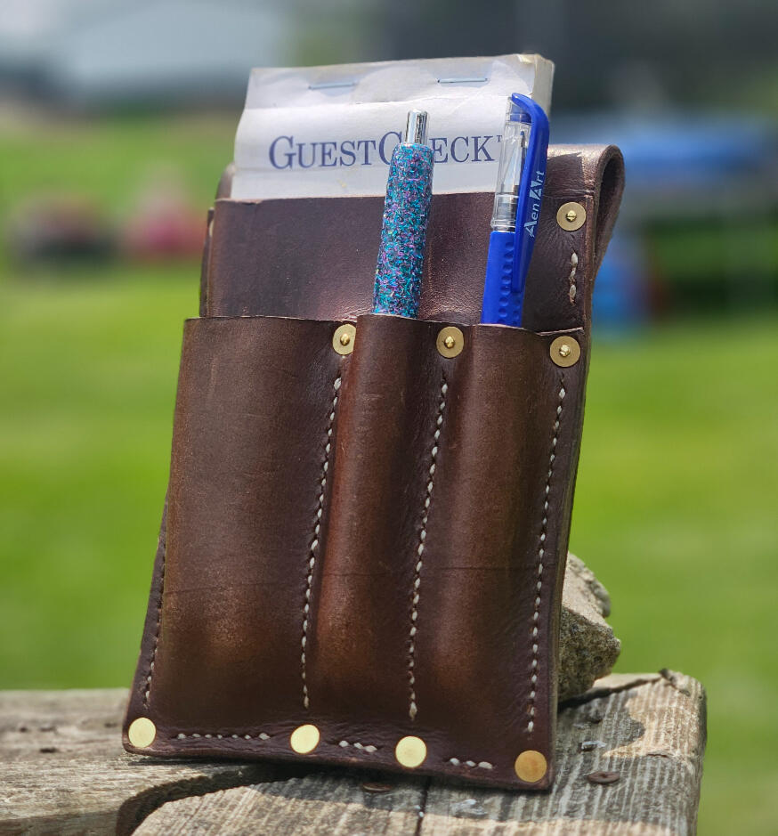 The Waitress | Pens, Note pad, and a misc sleeve.